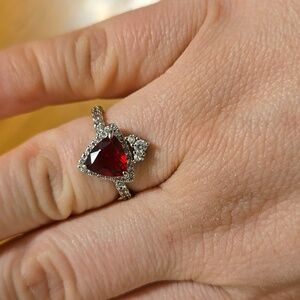 Red triangle stone with diamond accents ring